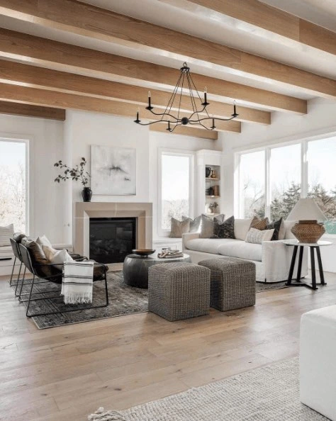 White oak living room flooring under exposed ceiling beams