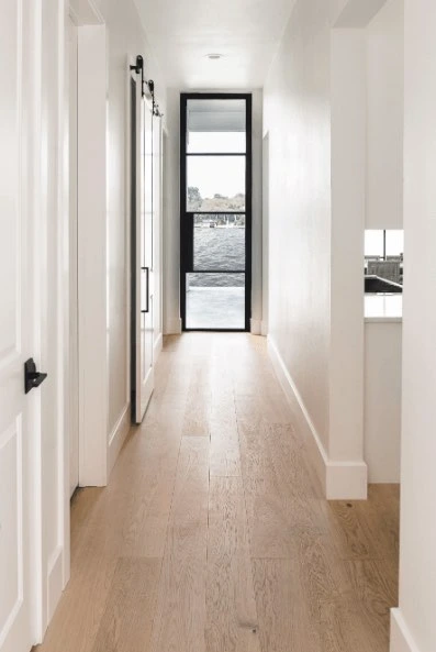 White oak hallway flooring running the length of an entryway