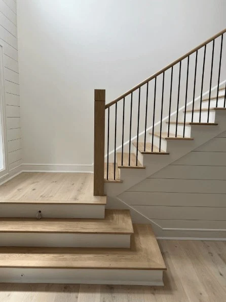 Oak stair treads with painted risers matched to white oak flooring
